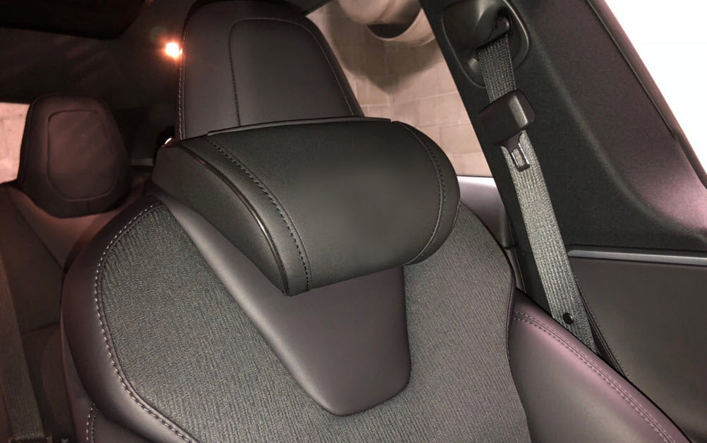 Inside of a Tesla with the black EV Premium Tesla headrests installed