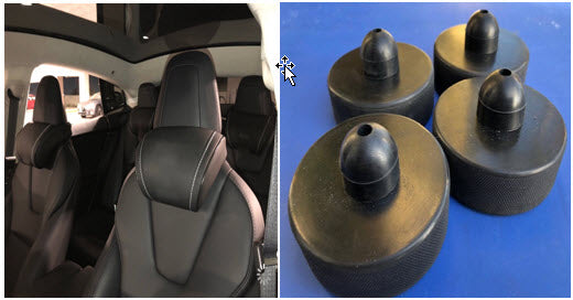 Inside of a Tesla with the black EV Premium Tesla headrests installed and 4 jackstand puck safety system