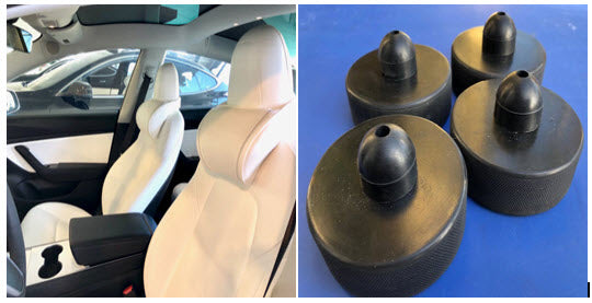 Inside of a Tesla with the white EV Premium Tesla headrests installed and 4 jackstand puck safety system