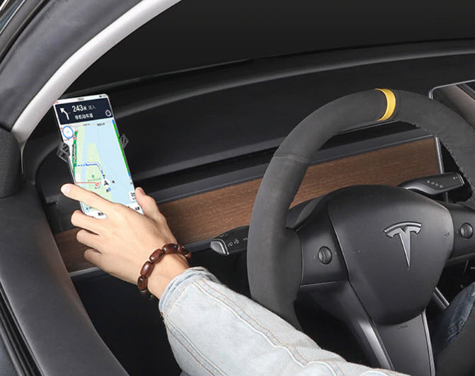 Tesla model 3 smartphone holder with a phone mounted on it