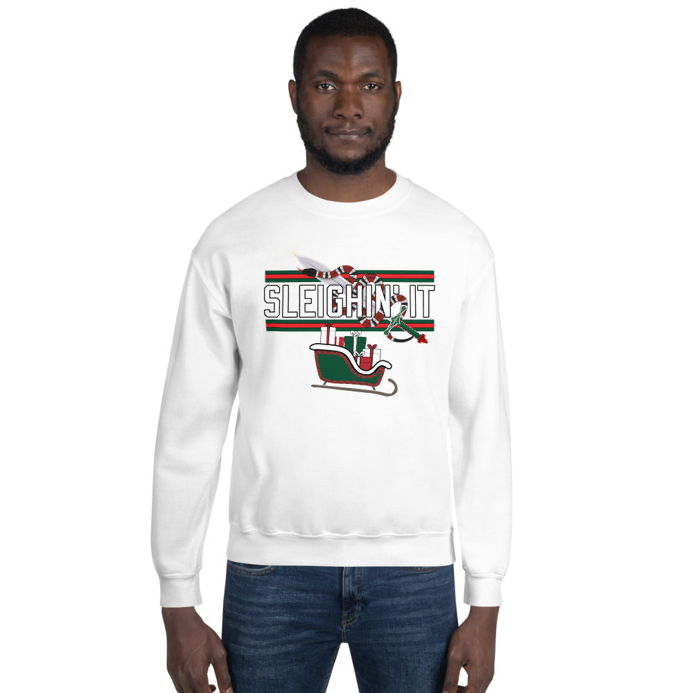 Man wearing a white Christmas-themed sweatshirt with the text "SLEIGHIN' IT" on it