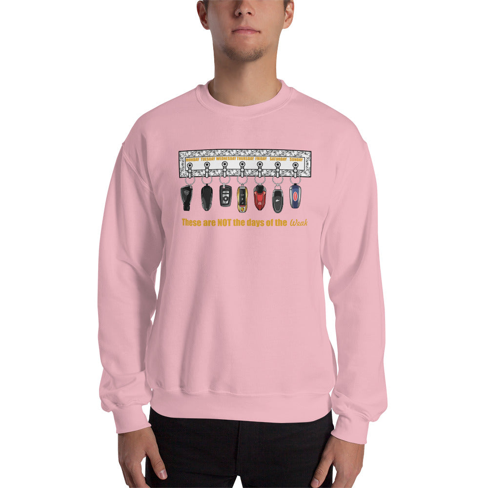 Man wearing a pink crew neck sweatshirt with car keys design and the text "These are NOT the days of the Weak"