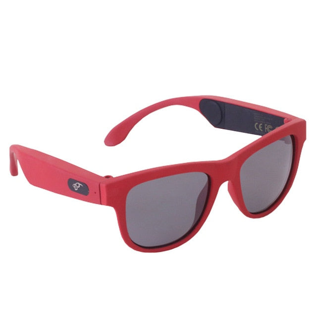 Red smart sunglasses with black tints on the lenses and wireless technology for calls